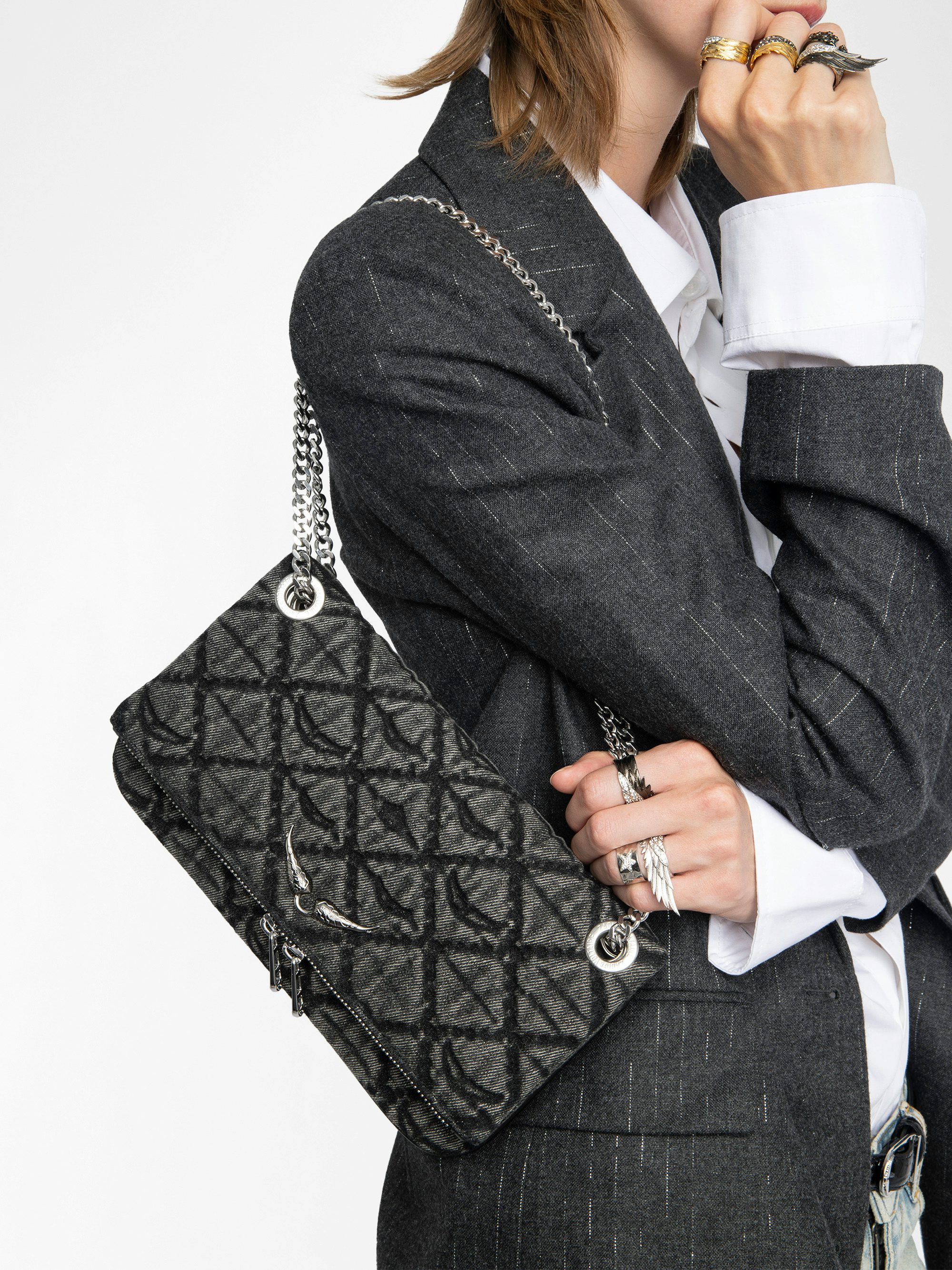 Rock II Monogram Clutch - Clutch in denim with sliding metal chain and signature wings.